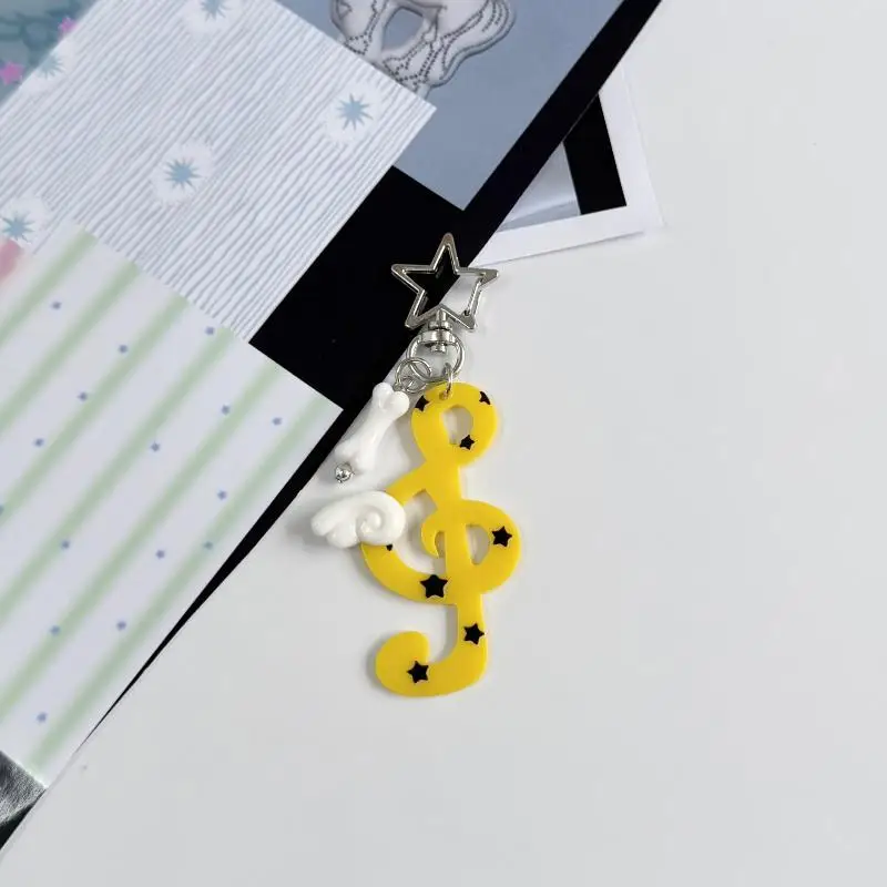 Niedliche Acryl-Musiknoten-Schlüsselanhänger mit hübscher Flügelverzierung in verschiedenen Farben, Taschenanhänger, Geschenke für Musikliebhaber. – Detail 5