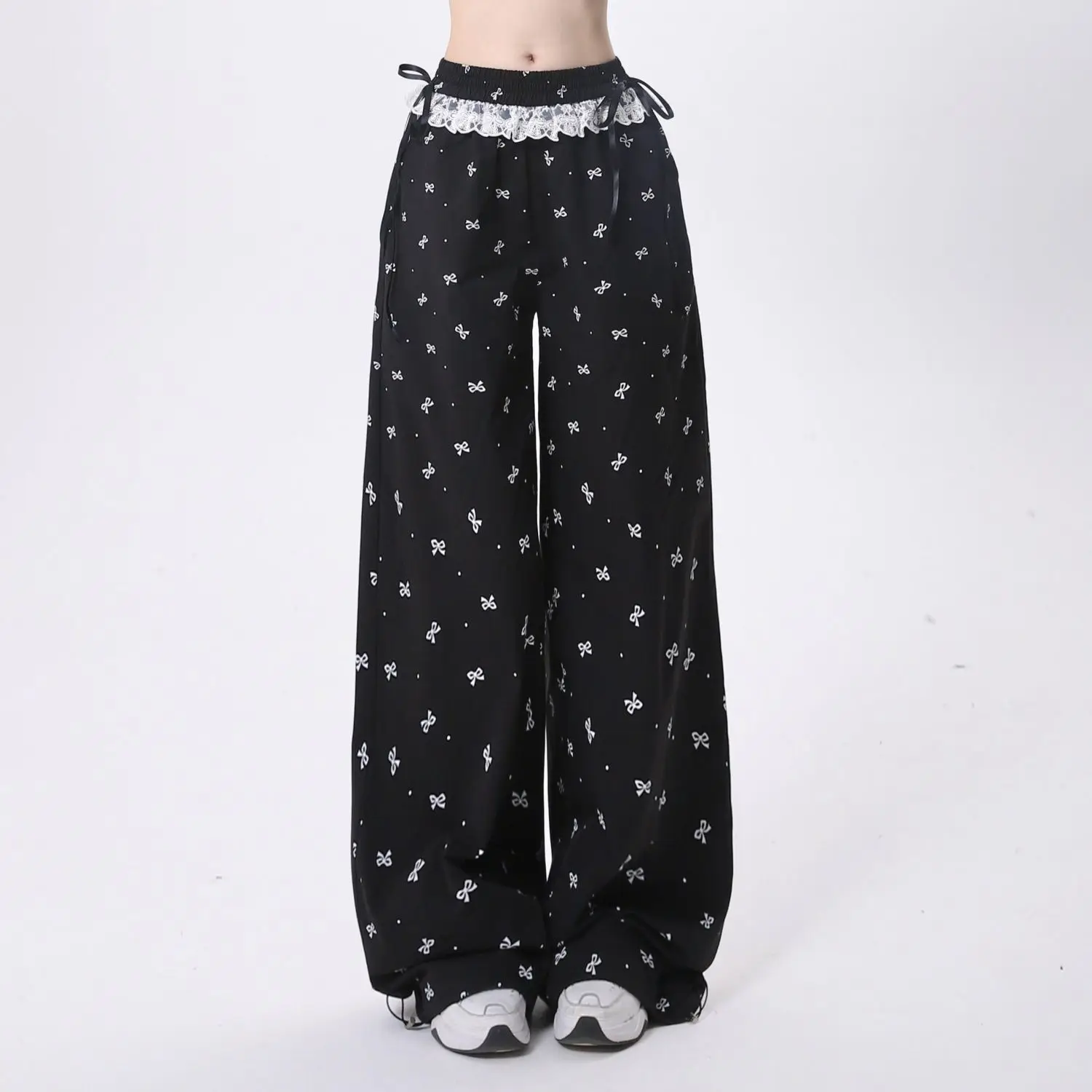 Damskie spodnie z kokardką ze słodką koronką koreańskie Retro Casual modne spodnie patchworkowy wzór letni luźny elastyczny pas prosta nogawka