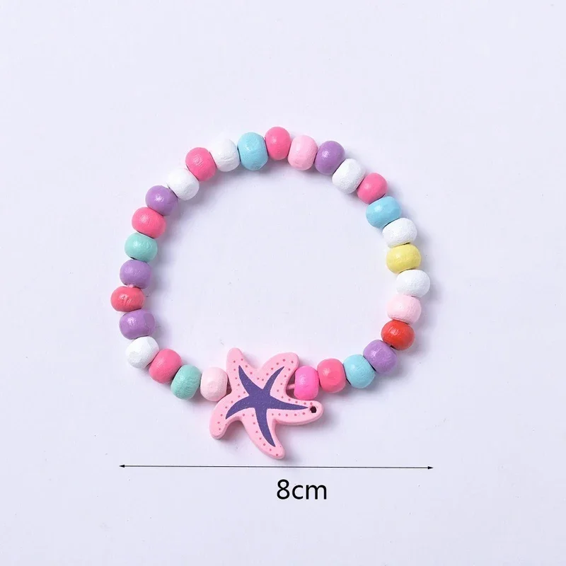 12 sztuk/opakowanie Kolorowe bransoletki z drewnianymi koralikami z motywami z kreskówek dla dziewczynek, upominki na przyjęcie urodzinowe, prezenty dla gości na baby shower, wypełniacze do piñaty — zdjęcie 6
