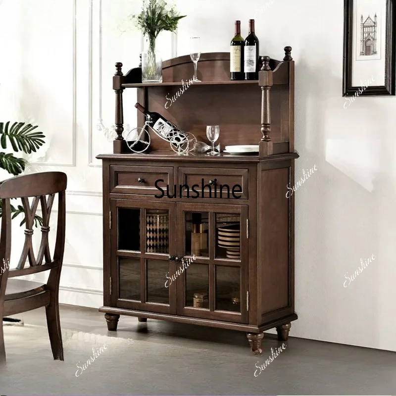 French retro solid wood side cabinet raised against the wall