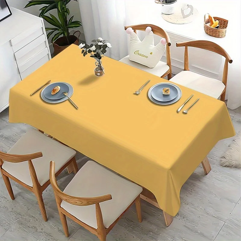 One yellow-colored practical tablecloth, creating a tidy dining table scene. Rectangular, durable polyester fabric.