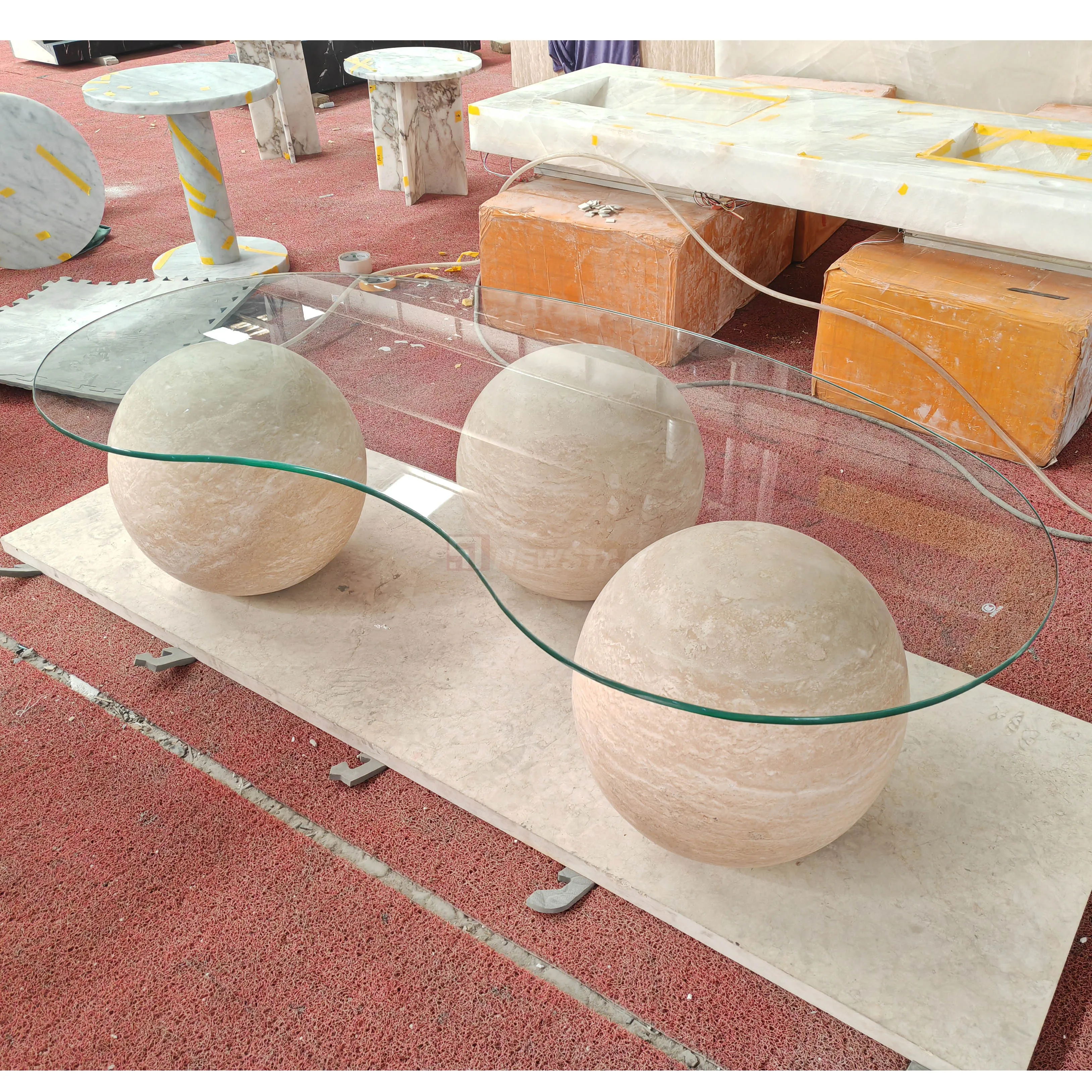 Luxury marble coffee table with spherical feet, glass top, suitable for hotels and restaurants