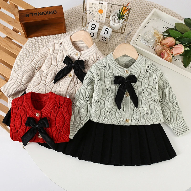 

Christmas Suit Autumn Red Baby Girl Cute Bow Suit Solid cardigan Long sleevessweater+Black Pleated skirt New Year Party Set 2Pcs