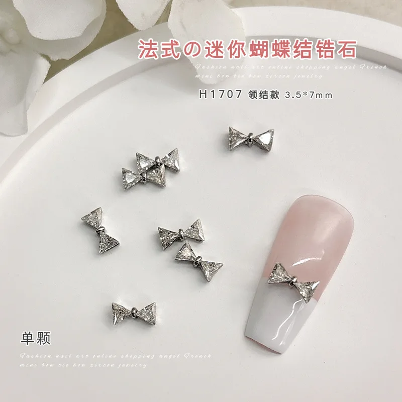10 Stück Französische Mini-Schleifen-Nagelbohrer-Accessoires mit super funkelndem 3D-Silber-Zirkon-Schleifenanhänger für die Maniküre