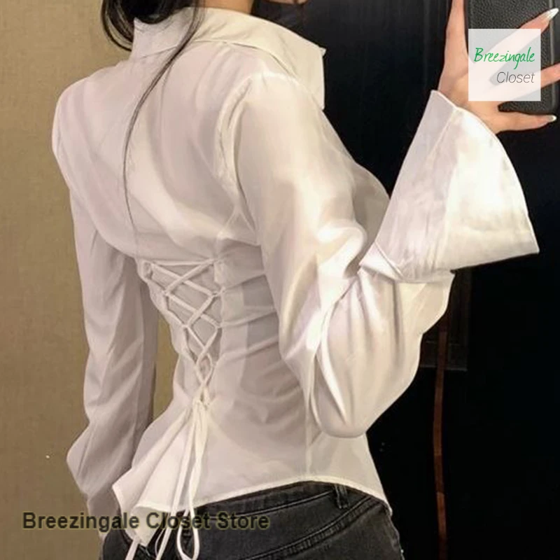 

French advanced strap long-sleeved trumpet strap waist shirt women's spring and summer new chic design white slim shirt top.