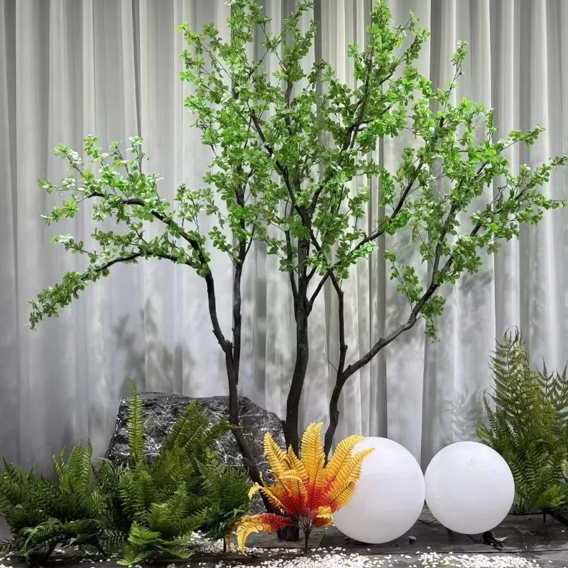 Elegant Floor Decoration Artificial Plant Landscape Design Solution Silk Green Plants Displayed in a showcase Window