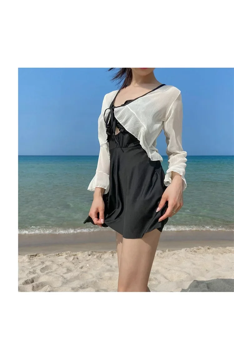 Nuevo vestido de una pieza para mujer, estilo conservador, que cubre la carne, blusa de manga larga con protección solar ligeramente gorda, junto al mar