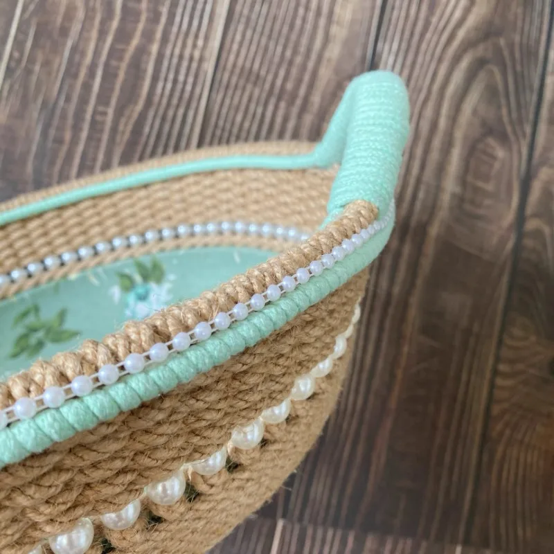 

Indoor furniture New product idyllic hand-woven round storage basket desktop sundries sorting snack basket rose fabric storage
