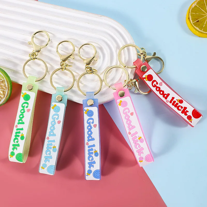 

miniso Pink translucent lollipop leather rope keychain pendant, cartoon oiled accessory, key chain ring bracelet