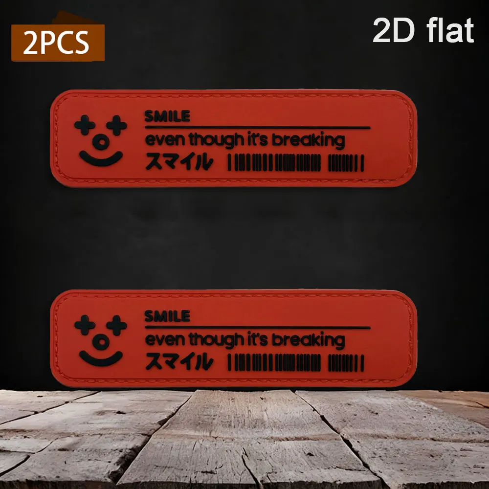 Available in various quantities: 1pc/2pcs/3pcs. 2D rectangular rounded-corner smiley face with Japanese and English barcodes. Made of PVC rubber. Comes with a furry base and three-dimensional embossed black character pattern. Available in yellow and red dual-color options. Neatly edged, waterproof, wear-resistant, and not prone to fading. Suitable for tactical vests, work bags, and functional trendy decorative patches