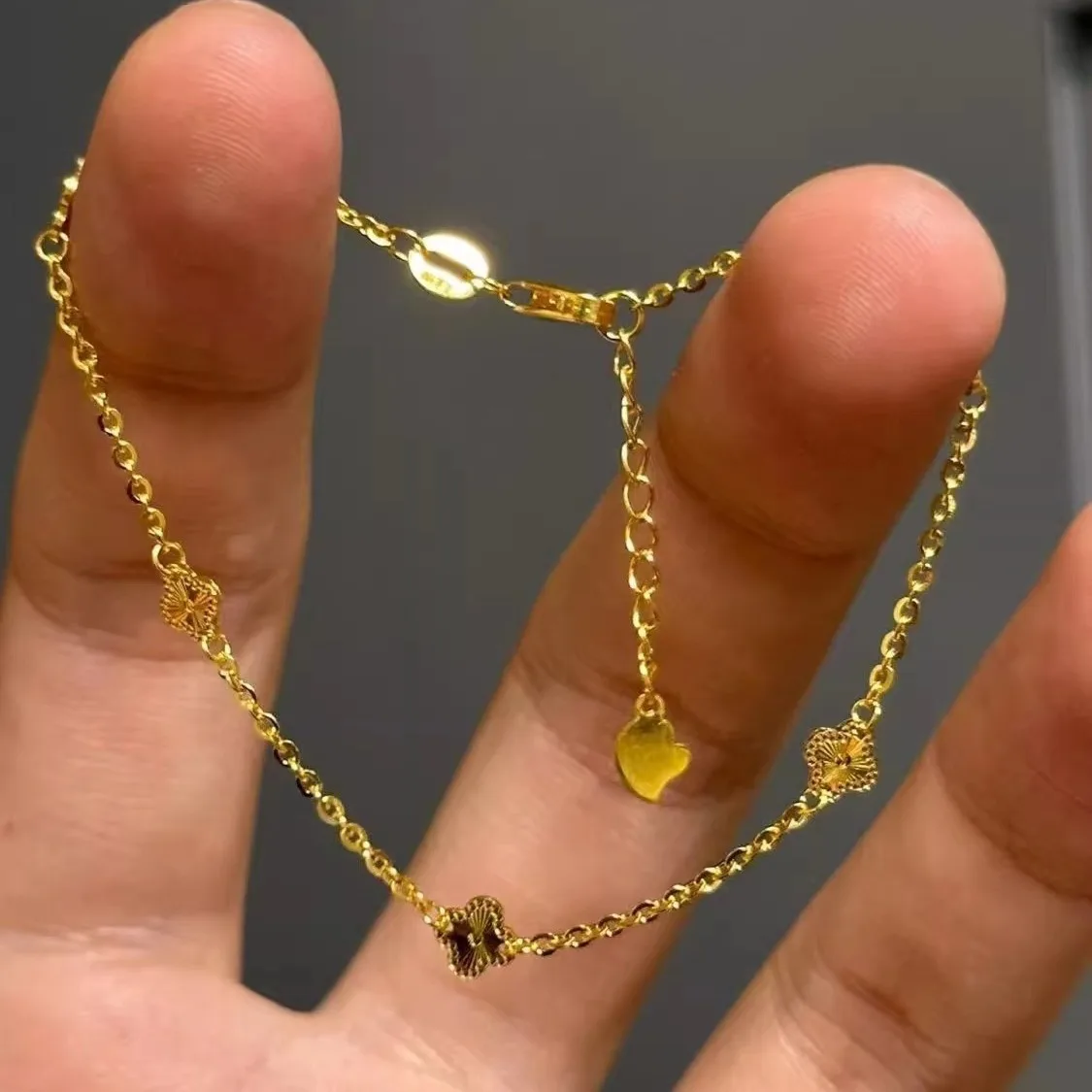 Light luxury 24K real gold four-leaf clover three-flower bracelet exquisite small women's light luxury au999 pure gold  jewelry