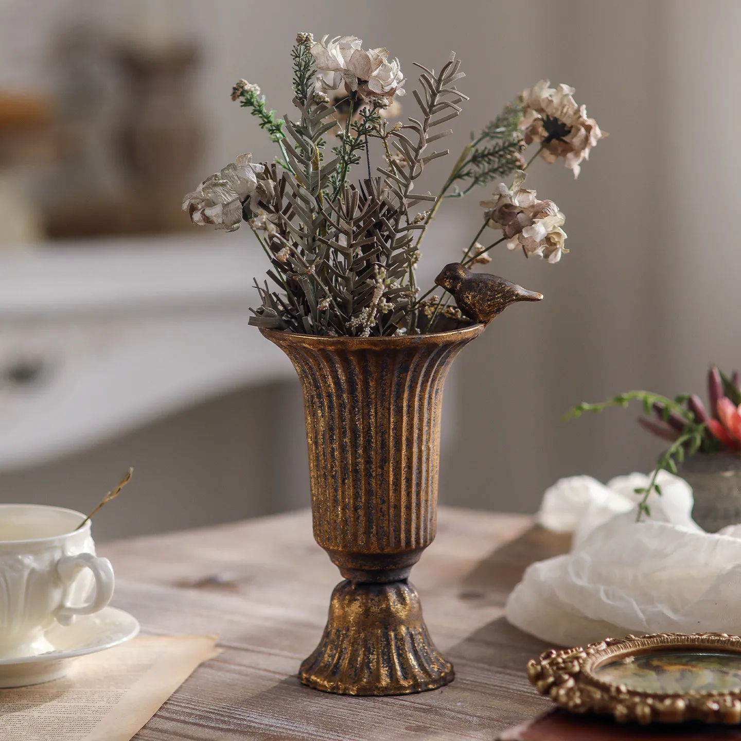 Old wrought iron dried flower vase flower arrangement hotel restaurant living room