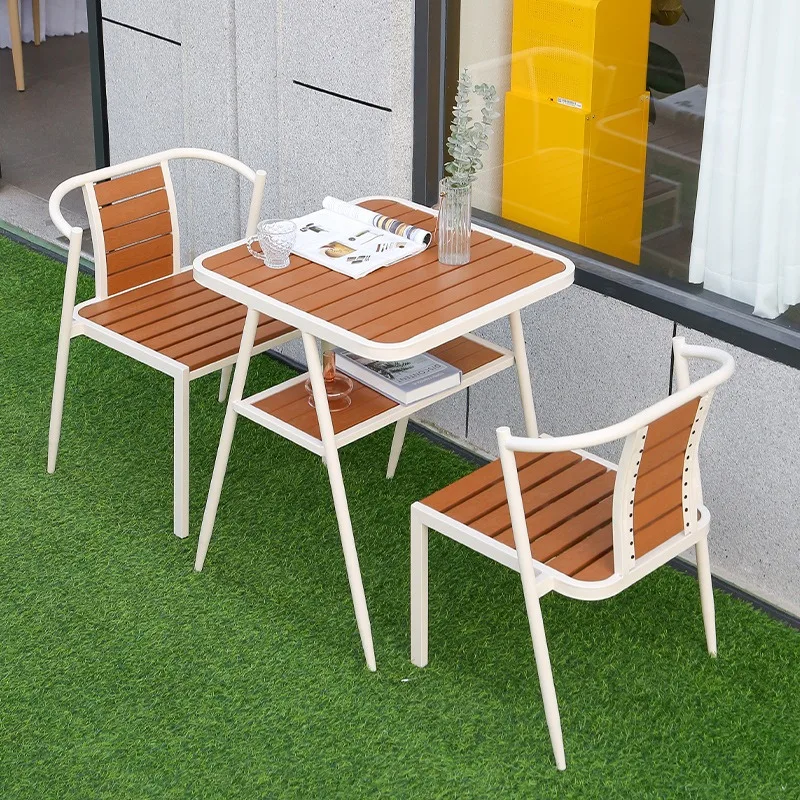 Outdoor tables and chairs Terrace courtyard Waterproof homestay Plastic wood tables and chairs three-piece set