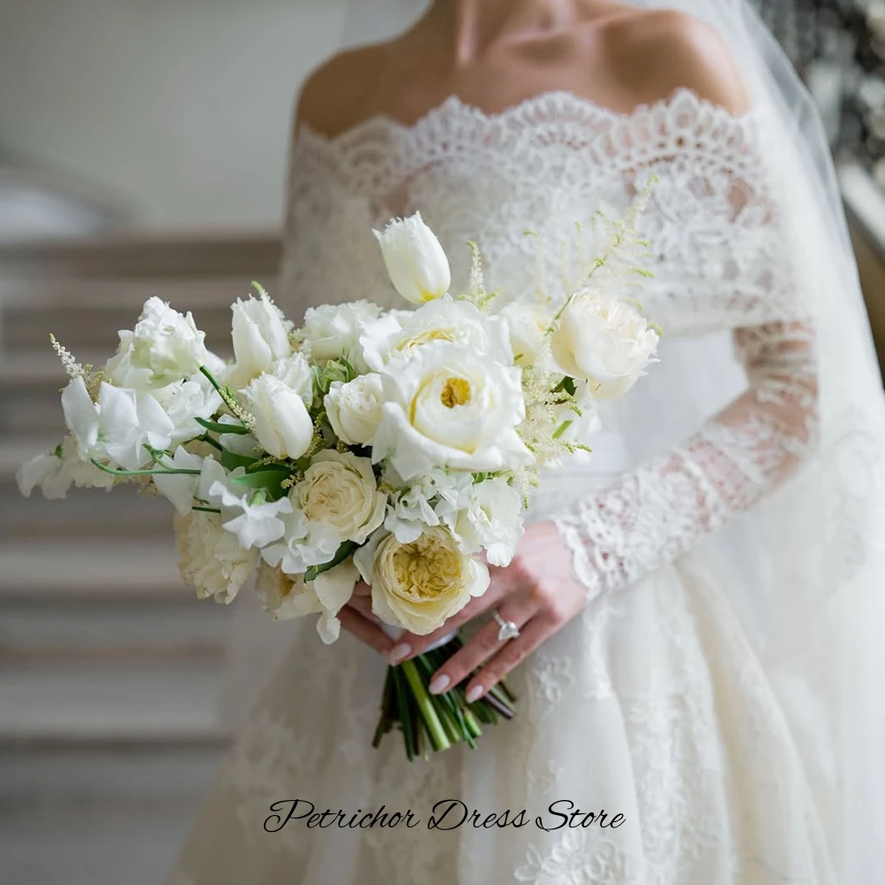 魅力的なボートネック長袖ウェディングドレスエレガントなカスタマイズされたAラインベスティドデノビア高品質アップリケレースブライダルドレス