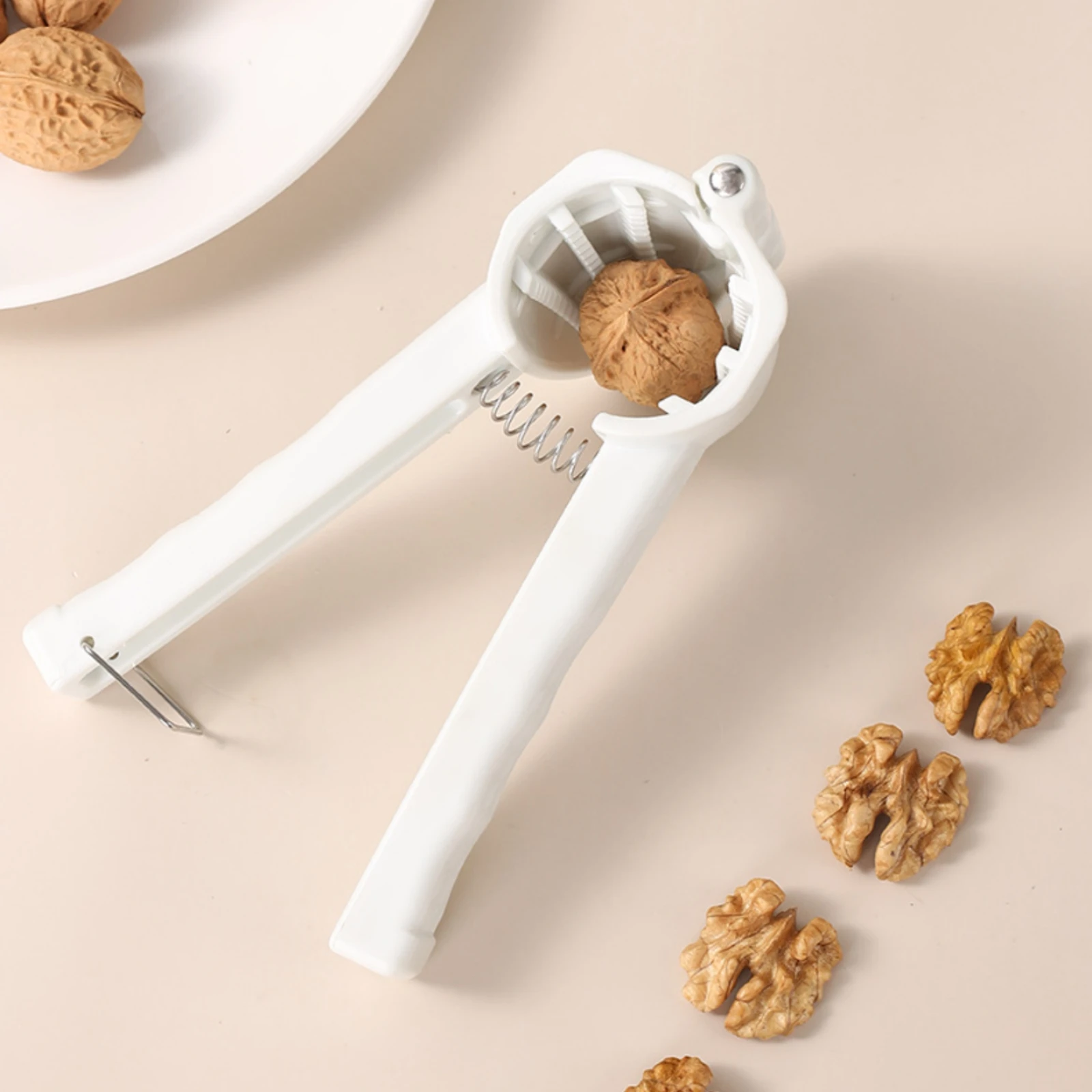 

Plier-Design Nutcracker Textured Gripping Surfaces Coiled-Loaded Nutcracker Walnut Sheller Serrated Food Prep Item Plastic And