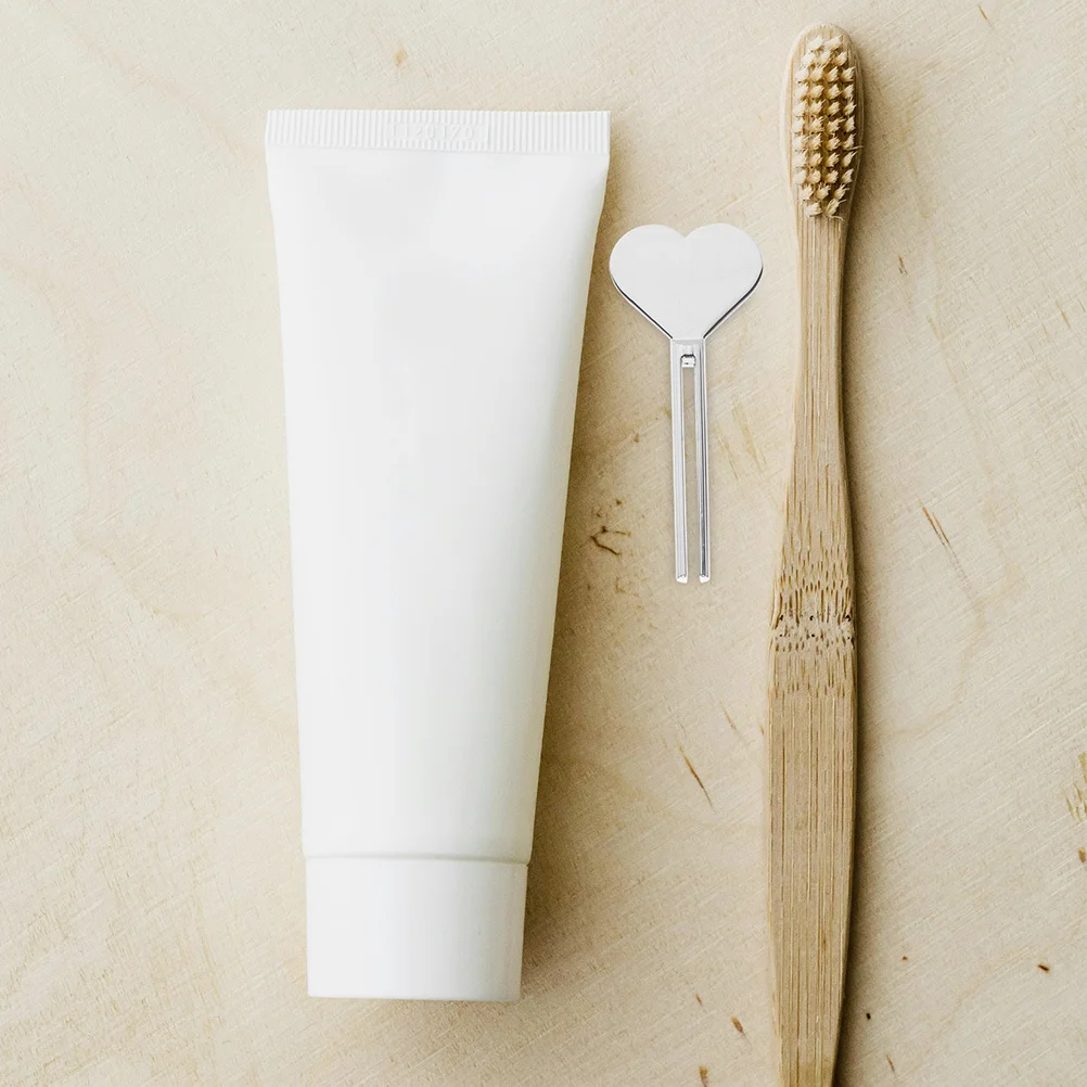 Exprimidores de pasta de dientes, herramienta exprimidora de tubo de Metal de aleación de Zinc para baño, tubo dispensador compacto en forma de corazón para uso doméstico, 4 Uds.