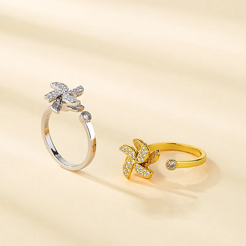 

Women's fidget spinner ring with an adjustable pinwheel shape, a creative stress relief gift for a girlfriend.