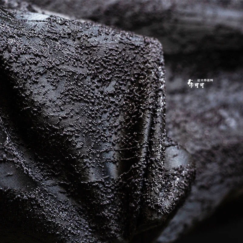 Tecido preto tridimensional textura de partículas jacquard gradiente reconstrução textura irregular arranjo tecido de roupas