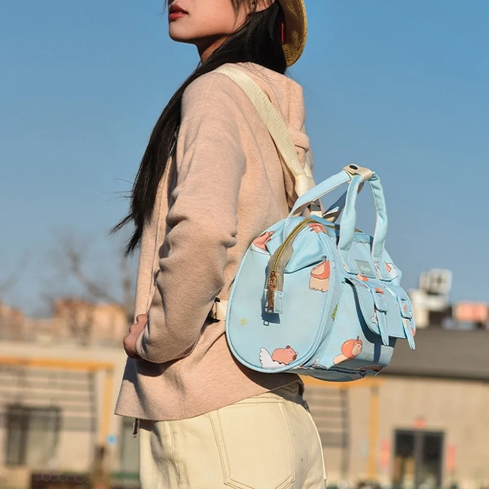 

Рюкзак для мамы с мультяшным принтом, многофункциональный прочный материал, дорожный рюкзак, дизайн для беременных, сумка для детских подгузников с защитой от брызг воды