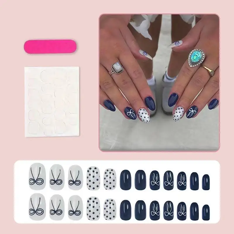 24PCS Navy blue and white polka dot oval artificial nails featuring hand-painted bow patterns Simple and fashionable manicure