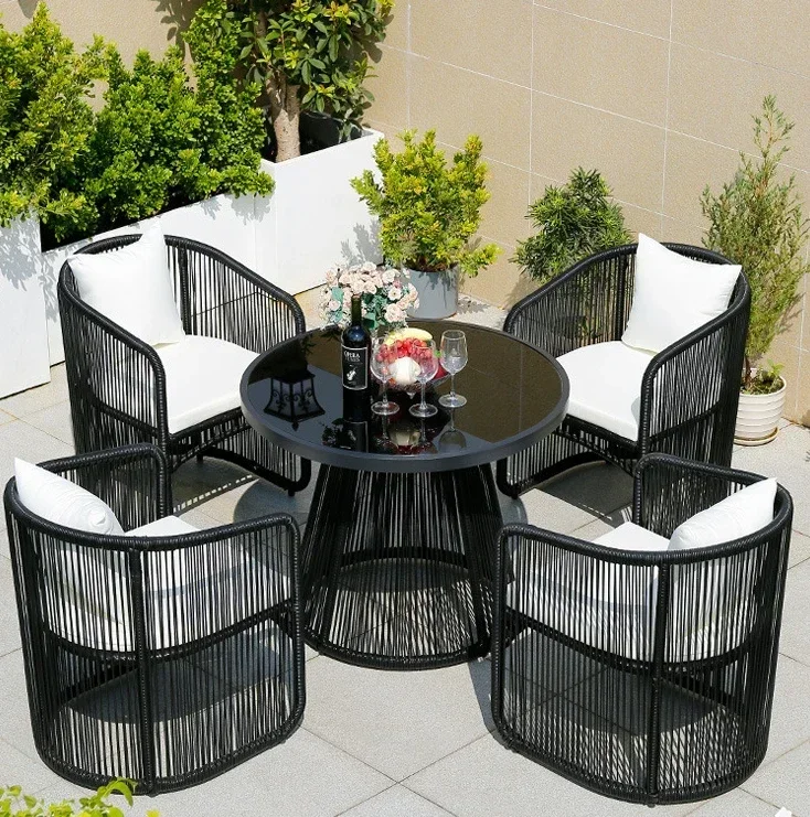 

Outdoor tables and chairs courtyard rattan chair combination terrace garden tea round table furniture waterproof and sunscreen.