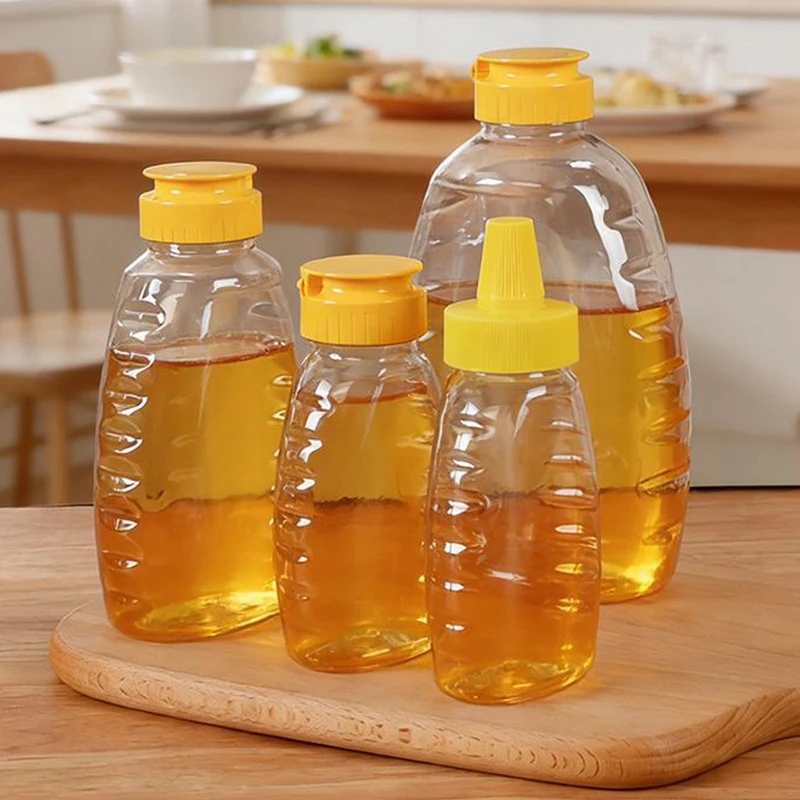 C Transparent Reusable Plastic Honey Bottles Squeeze Honey Bottle Container Holder With Lid For Storing And Dispensing Honey Jar