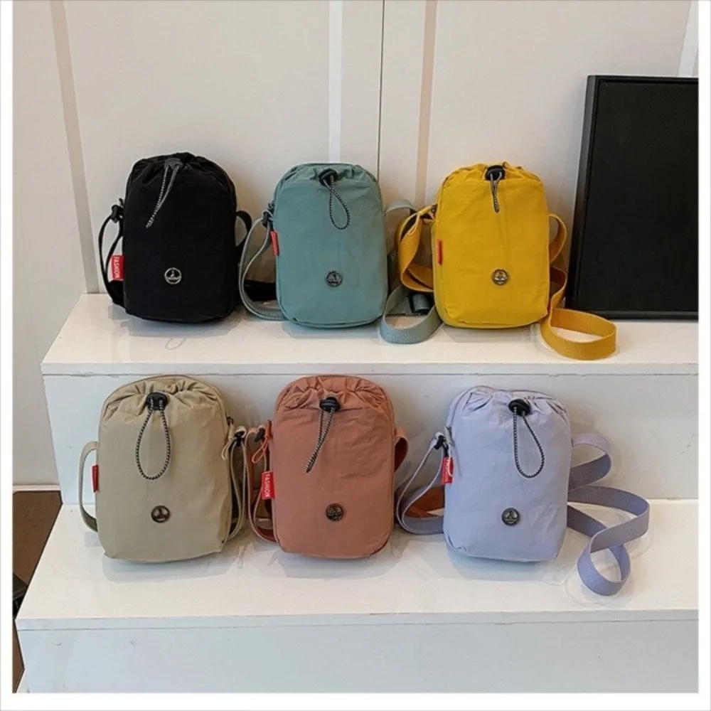 

Versatile Nylon Fabric Single Shoulder Bag Solid Color Sports Style Small Bag Casual Drawstring Mobile Phone Bag Unisex