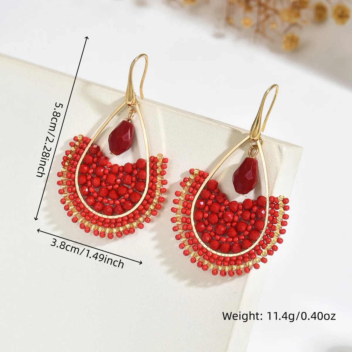 Handcrafted bohemian-style fan-shaped pendant earrings, perfect for women. These beaded earrings are suitable for any occasion,