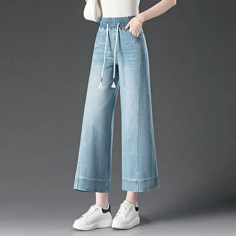 Spodnie damskie z wysokim stanem, szerokie nogawki, długość 7/8, elastyczna gumka w pasie, nowość na lato 2025, luźne, duże rozmiary, elastyczne jeansy.