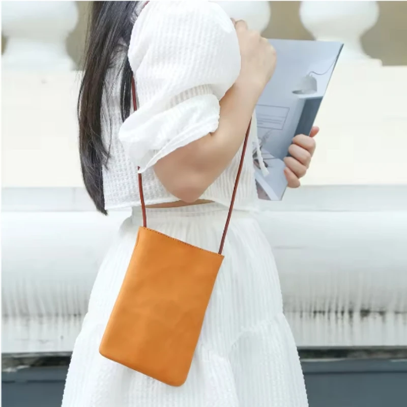 

Pull-string women's mini handbag with a slanted cross-body design, new style, simple leather, shoulder-borne, small-sized handba