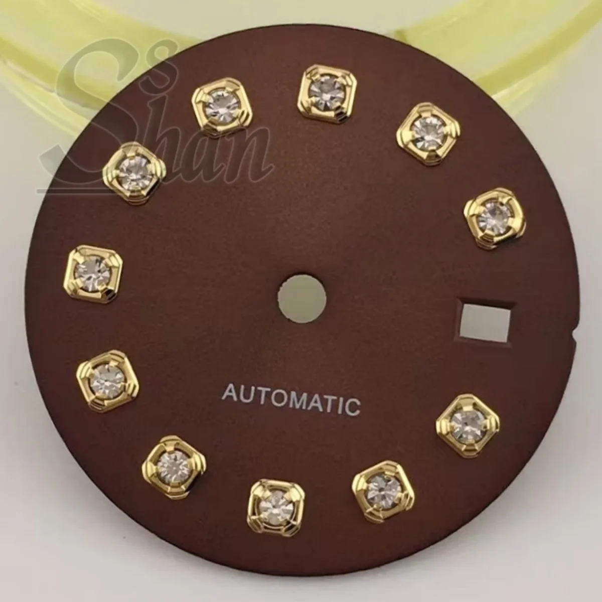 NH05 20.5mm dial with gold silver rose gold diamond indices is paired with a 26mm NH05 movement component a brown sunburst dial