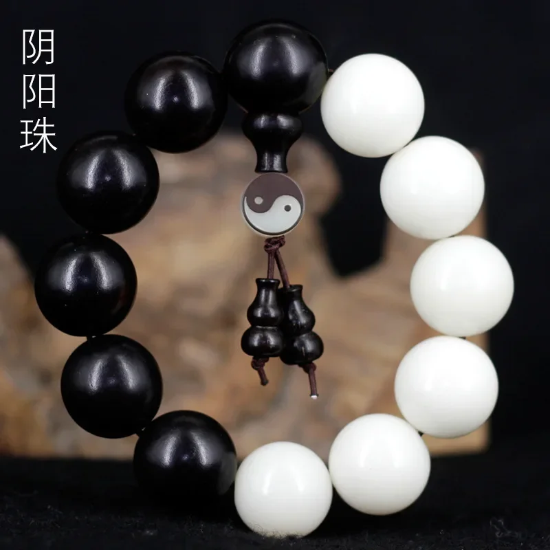 

Yin and Yang bead white jade Bodhi root black sandalwood bead hand string bracelet calligraphy male and female eight diagrams