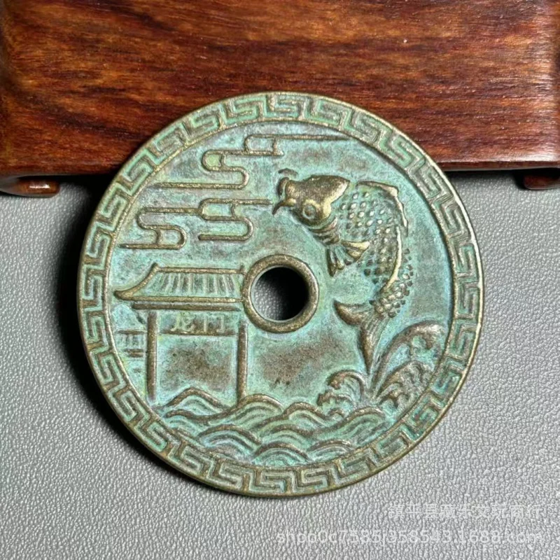 Antique double-sided hand-carved coin with inscription 