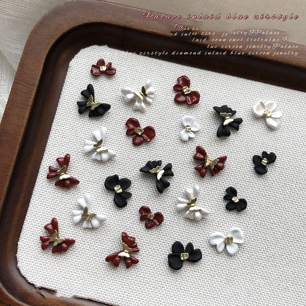 5 pezzi bianco/nero/vino rosso farfalla fiore decorazioni per unghie artistiche fiocco in lega 3D ciondoli per unghie eleganti accessori per unghie artigianali alla moda