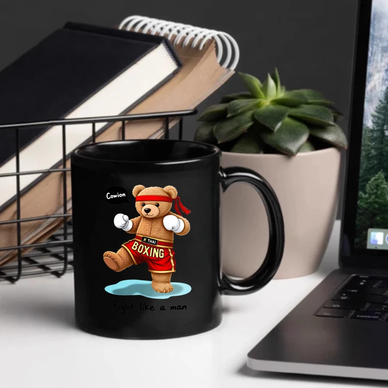 Black ceramic mug with a cute boxing bear pattern and the text 