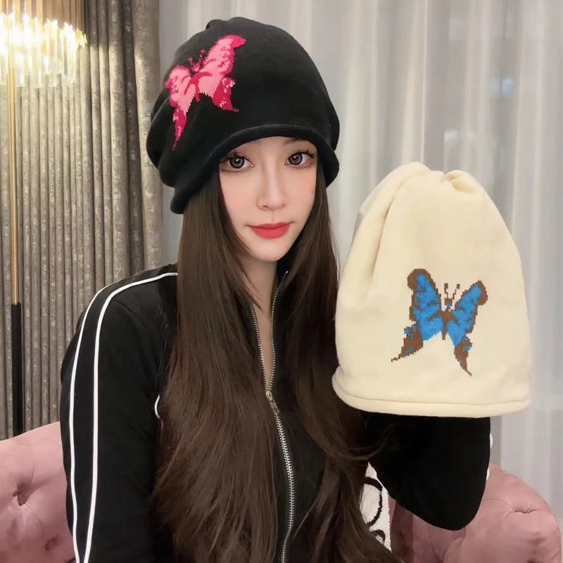 Spicy girl style autumn and winter anti-aging fashion knitted butterfly pile pile hair versatile hooded shopping pullover hat