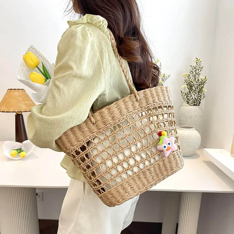 Ladies' Handbag 2026 New Seaside Vacation Style Hollowed Out Grass Woven Beach Bag Trendy Casual Vacation Shoulder Tote Bags