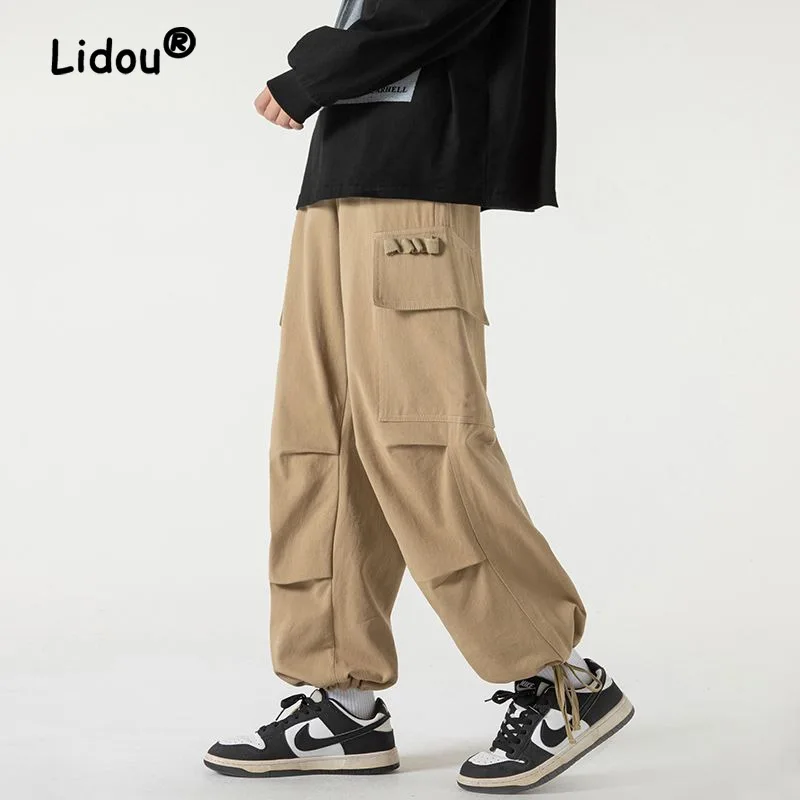 Fashion Solid Color Large Pocket Pleated Men's Cargo Pants New Tie One's Feet Design Sense Hong Kong Breeze Male Trousers