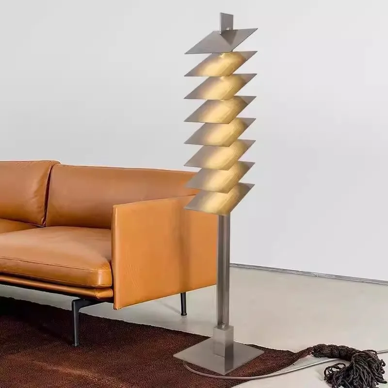 Stainless steel new designer creative sense living room bedroom sofa floor lamp model room light and shadow model