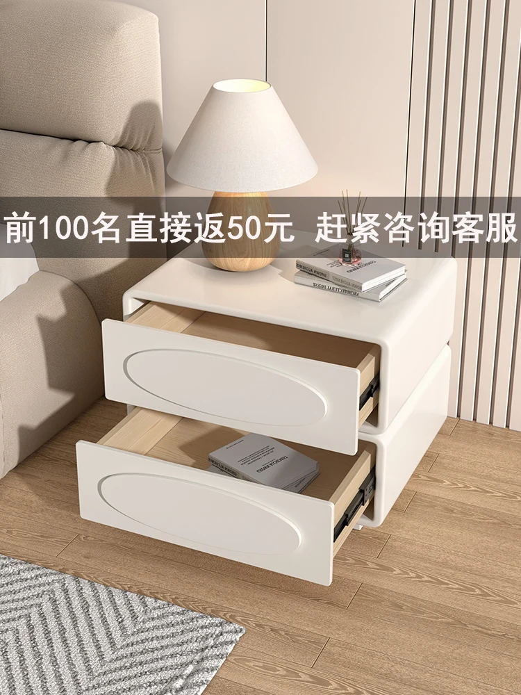 Cream wind Italian minimalist bedside table luxury modern simple solid wood paint household bedroom bedside storage cabinet.