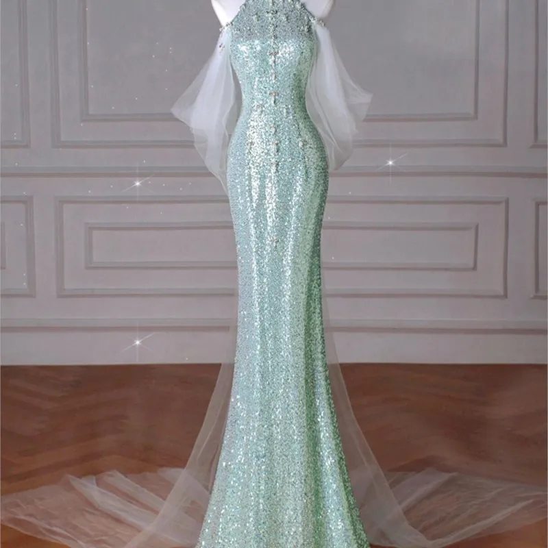 

Mint green fishtail toast Light luxury niche host will banquet backless sequin halter dress