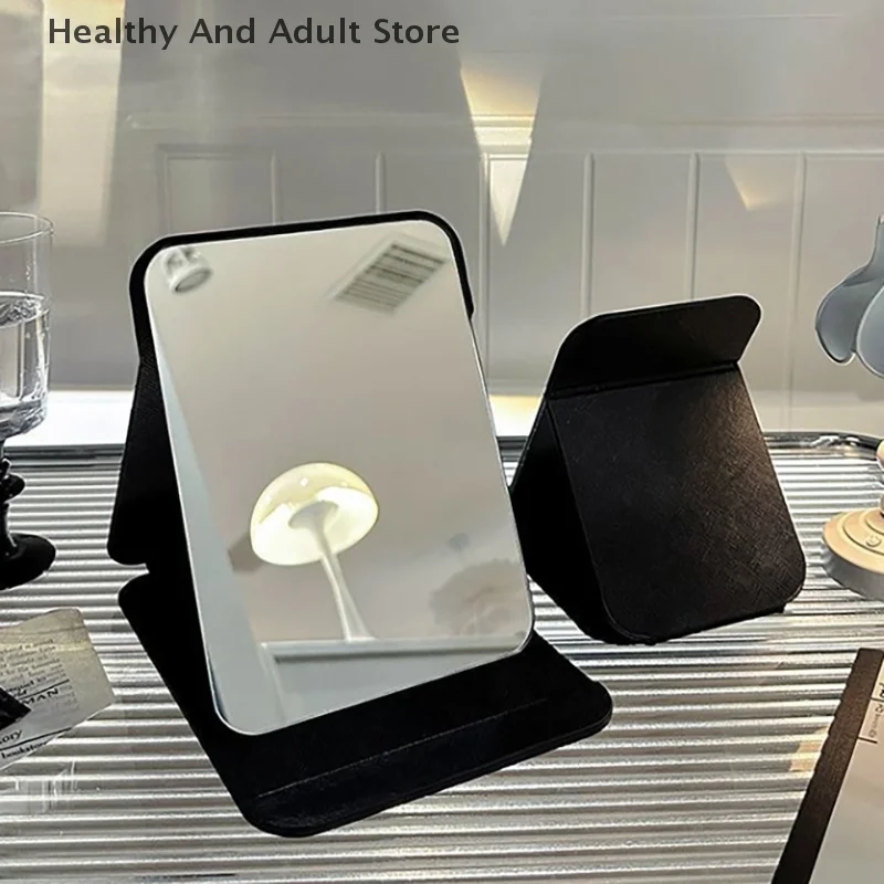 Desktop-Make-up-Spiegel, einfarbig, PU-Leder, einfacher tragbarer schwarzer Handspiegel, faltbar, für Studenten, kompakt, niedlicher Taschenspiegel