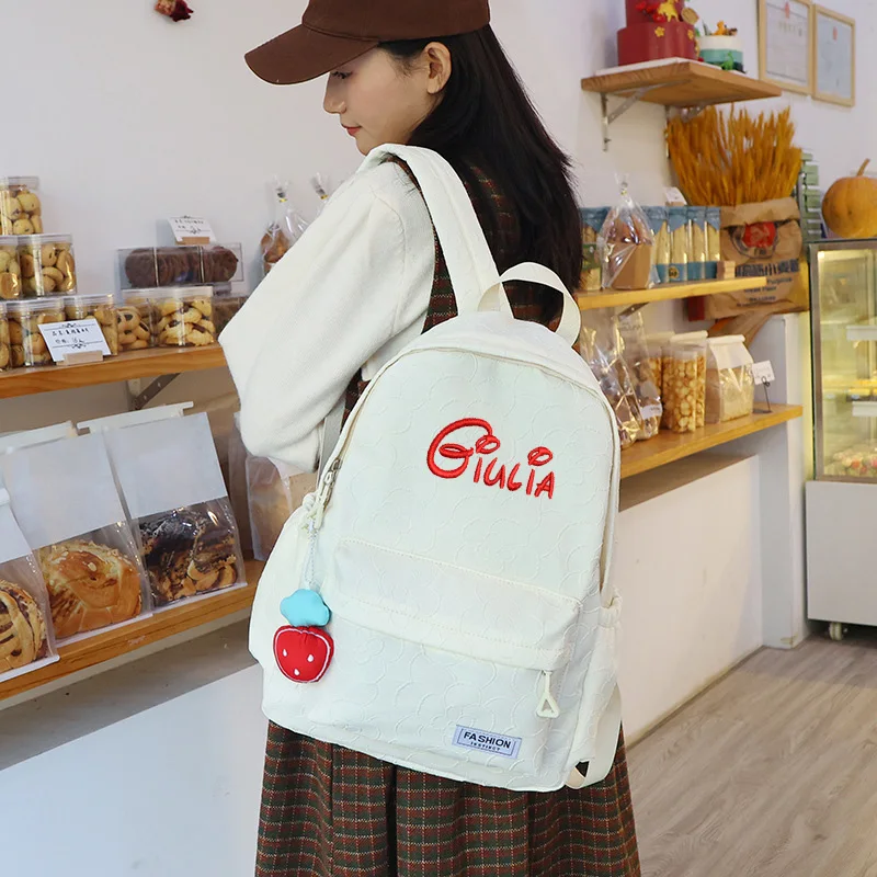 Zaino carino personalizzato borsa da scuola per studenti di grande capacità ricamata personalizzata borsa da regalo in Nylon per bambini in tinta unita