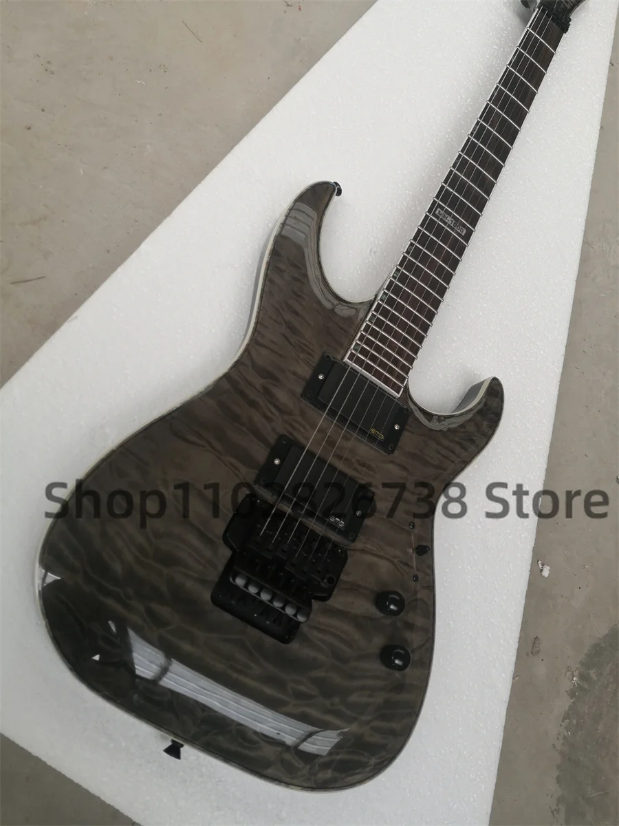 Clear black electric guitar Squilted Maple Top Maple neck Set In body Rosewood fingerboard 1000 inlaid tremolo bridge closed pic