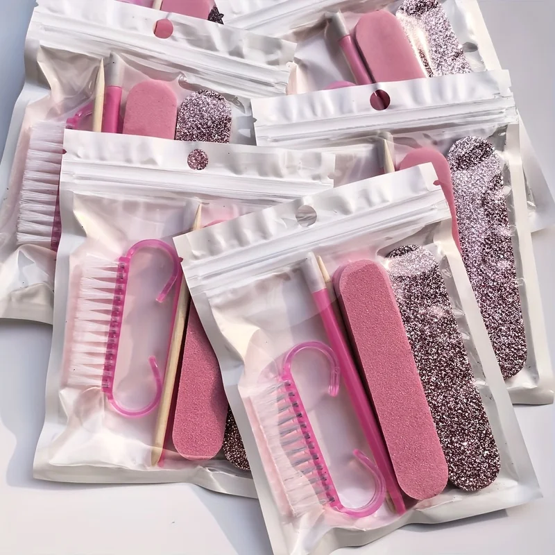 5Manicure and pedicure set, including a mini nail file, a nail buffer, a wooden cuticle pusher, and a nail brush
