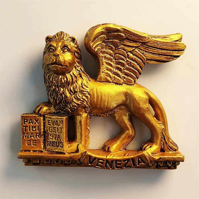 The iconic flying lion statue of Venice, Italy, is a tourist souvenir, craft, magnetic refrigerator magnet made of resin.