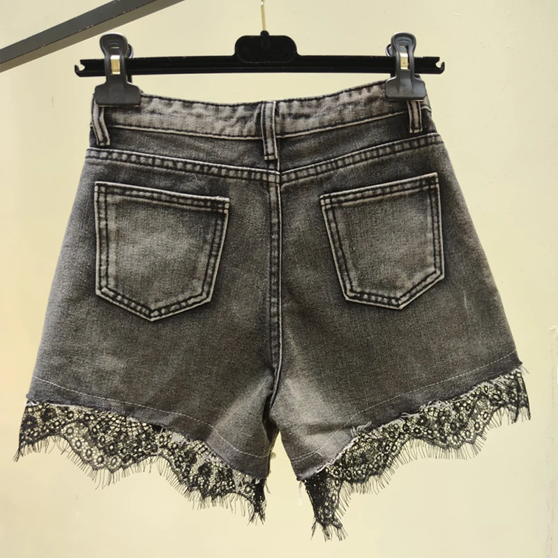 Pantaloncini di Jeans 2024 estate delle nuove donne a vita alta in pizzo perla Hotpants a-line Jeans Slim coreano Casual larghi pantaloncini a gamba larga