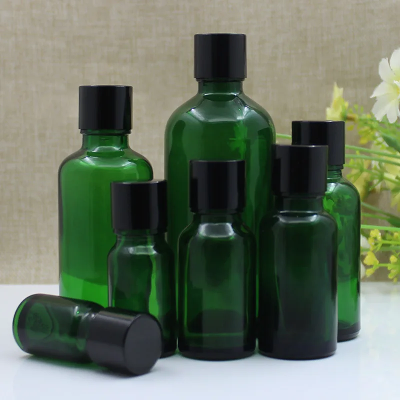 24 pezzi 5 ml 10 ml 15 ml 20 ml 30 ml 50 ml 100 ml Bottiglia di olio essenziale di vetro verde Bottiglia vuota per imballaggio cosmetico Cura personale con coperchio