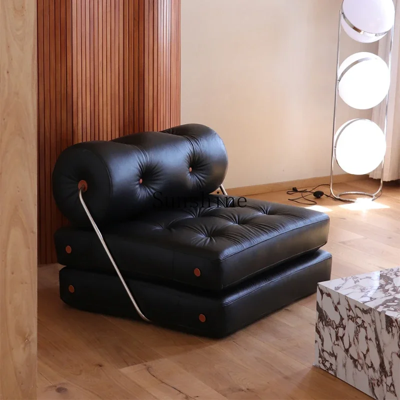 Retro black first-layer cowhide single sofa bed