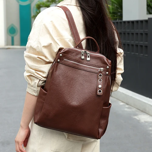 Mochilas de cuero de vaca Natural para mujer, bolsos de gran capacidad con diseño de piel de vaca, mochilas versátiles Retro para mujer, bolso de moda para mujer